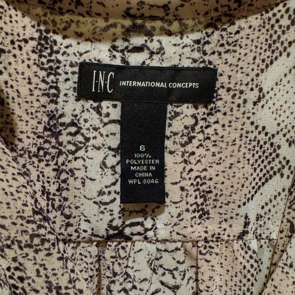 INC International Concepts Woman’s patterned blouse.